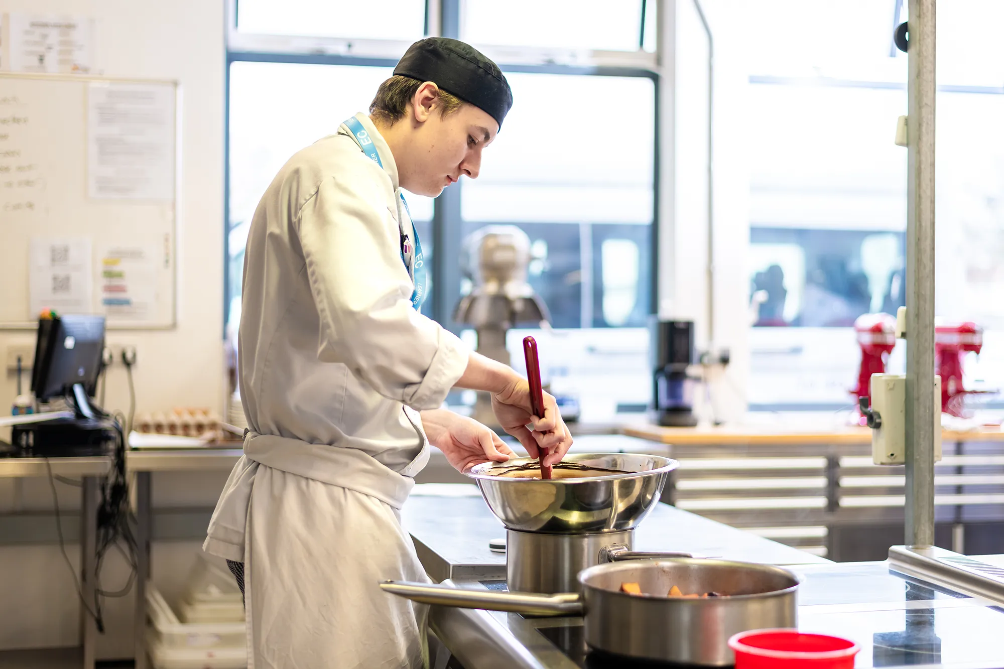 student melting chocolate on a double boiler