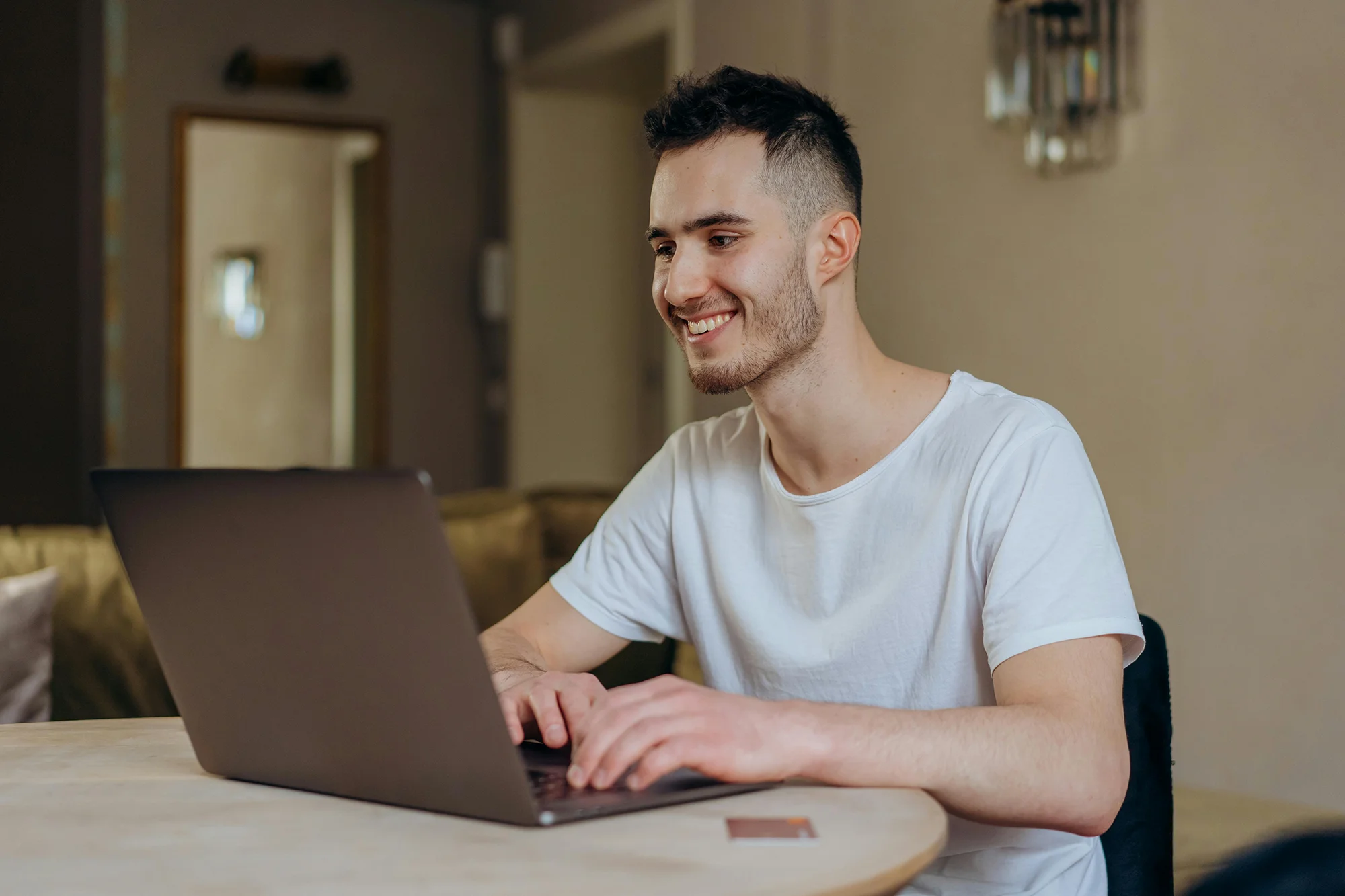 Young man studying online at home