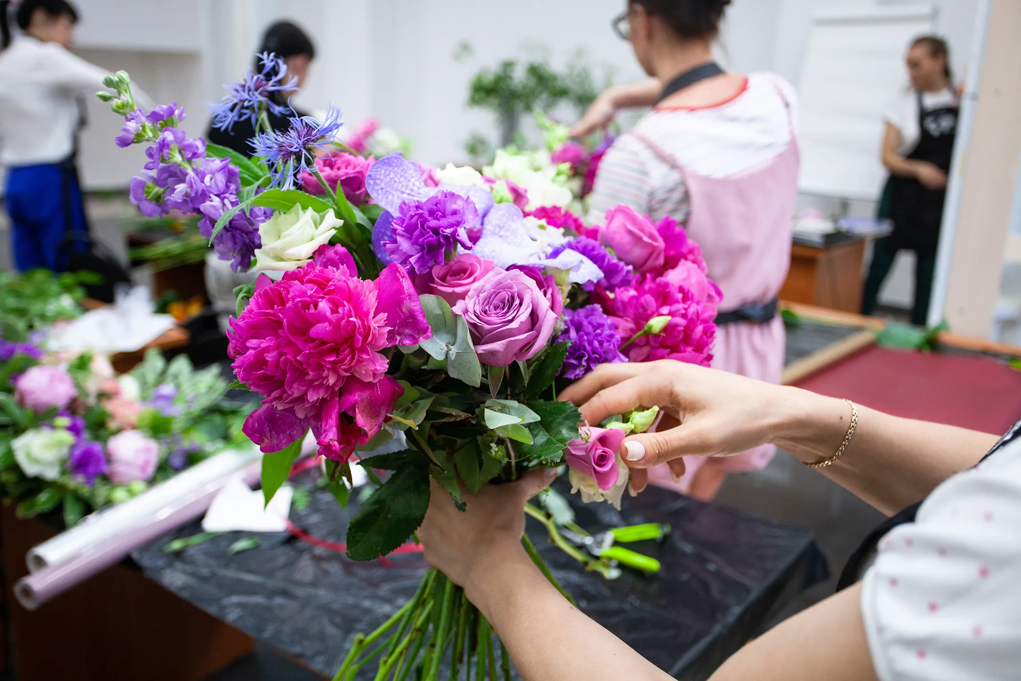 person arranging flower