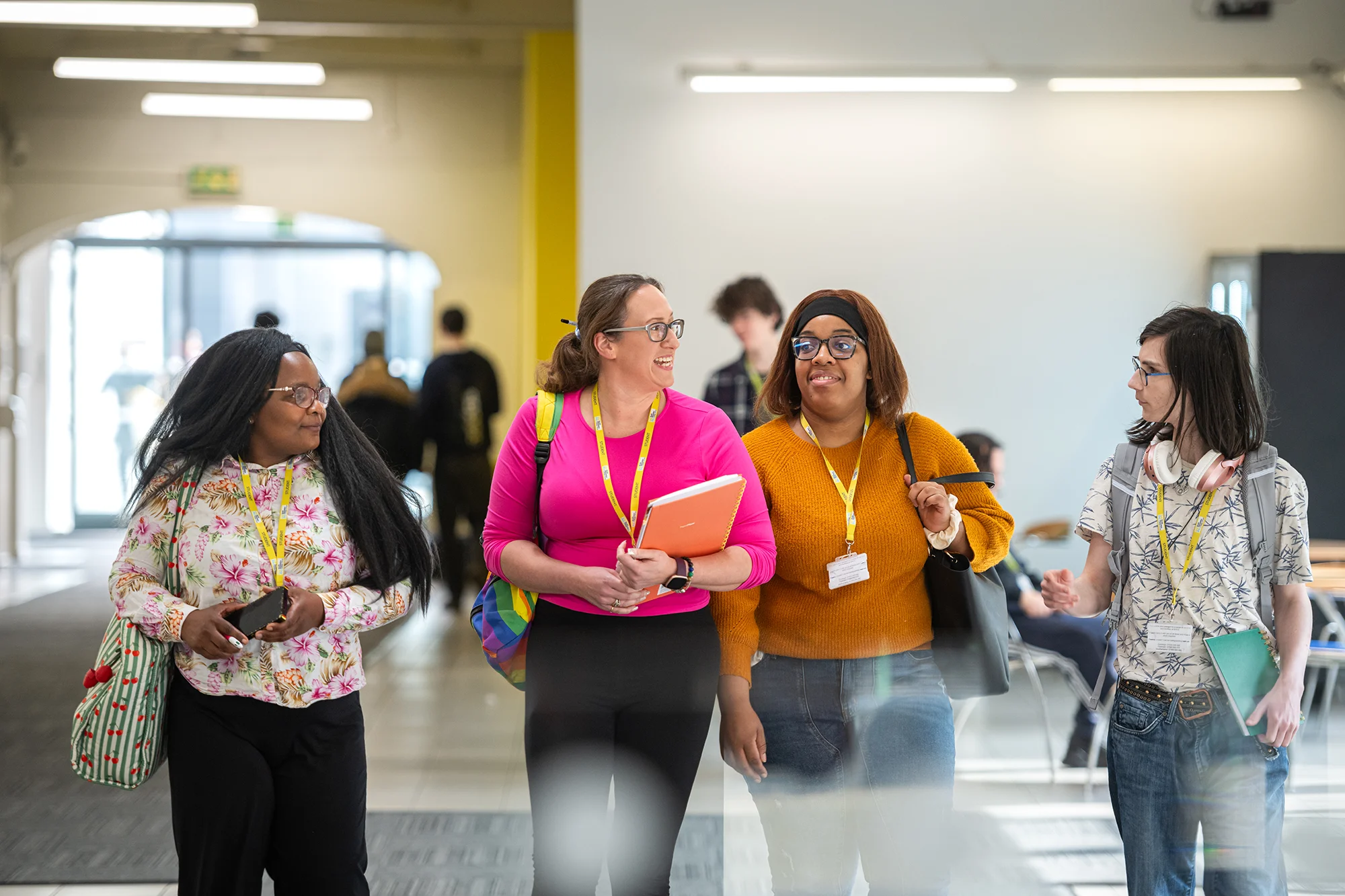 adult students walking through a college campus