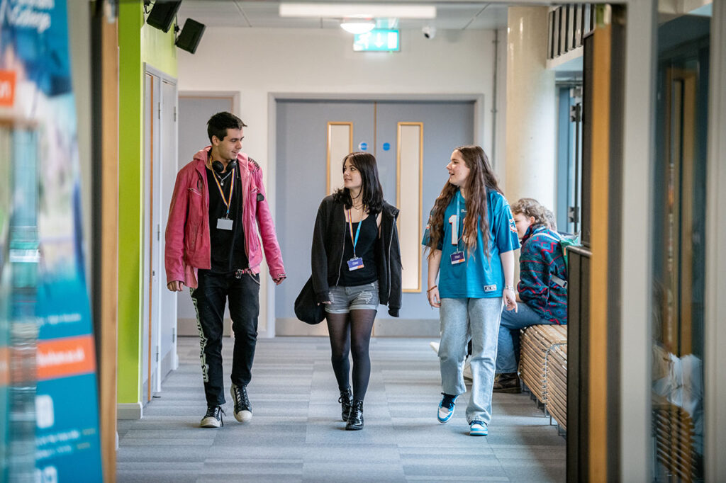 Students Walking Down Corridor