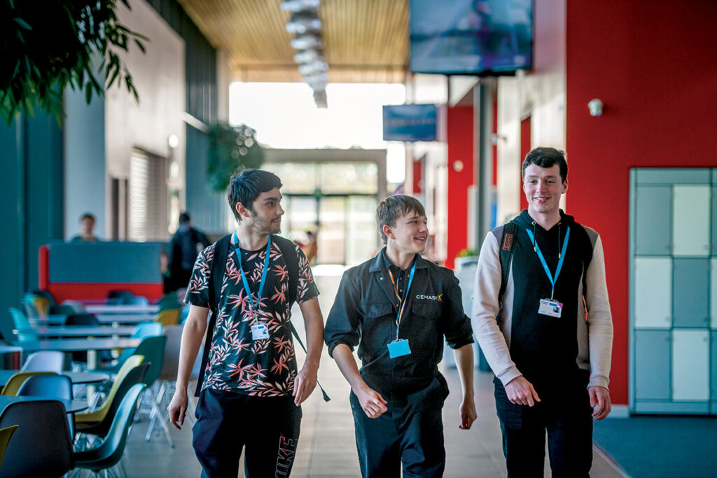 Students Walking and chatting in corridor